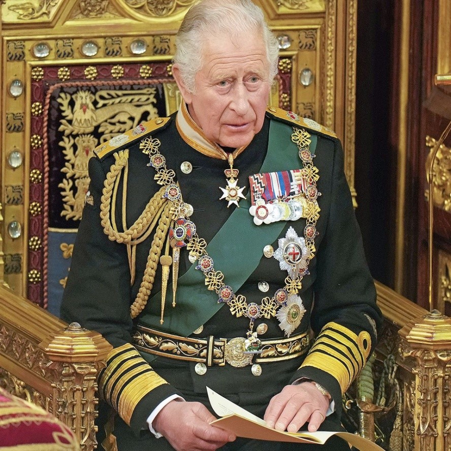 King Charles III seated on the throne